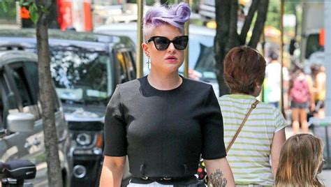 kelly osbourne nude|Kelly Osbourne surrounded by naked model for photoshoot